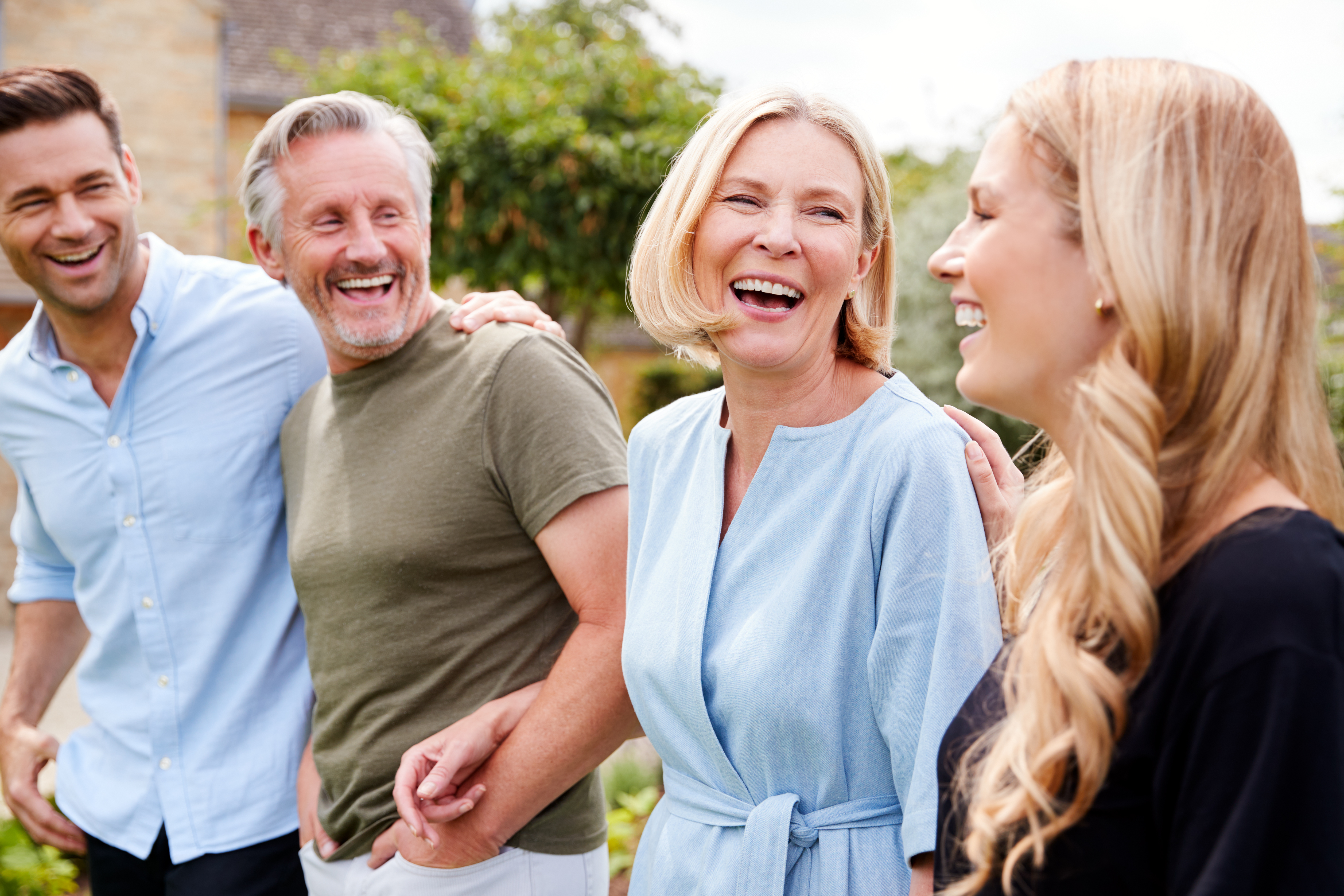 A family photographed smiling | Source: Shutterstock