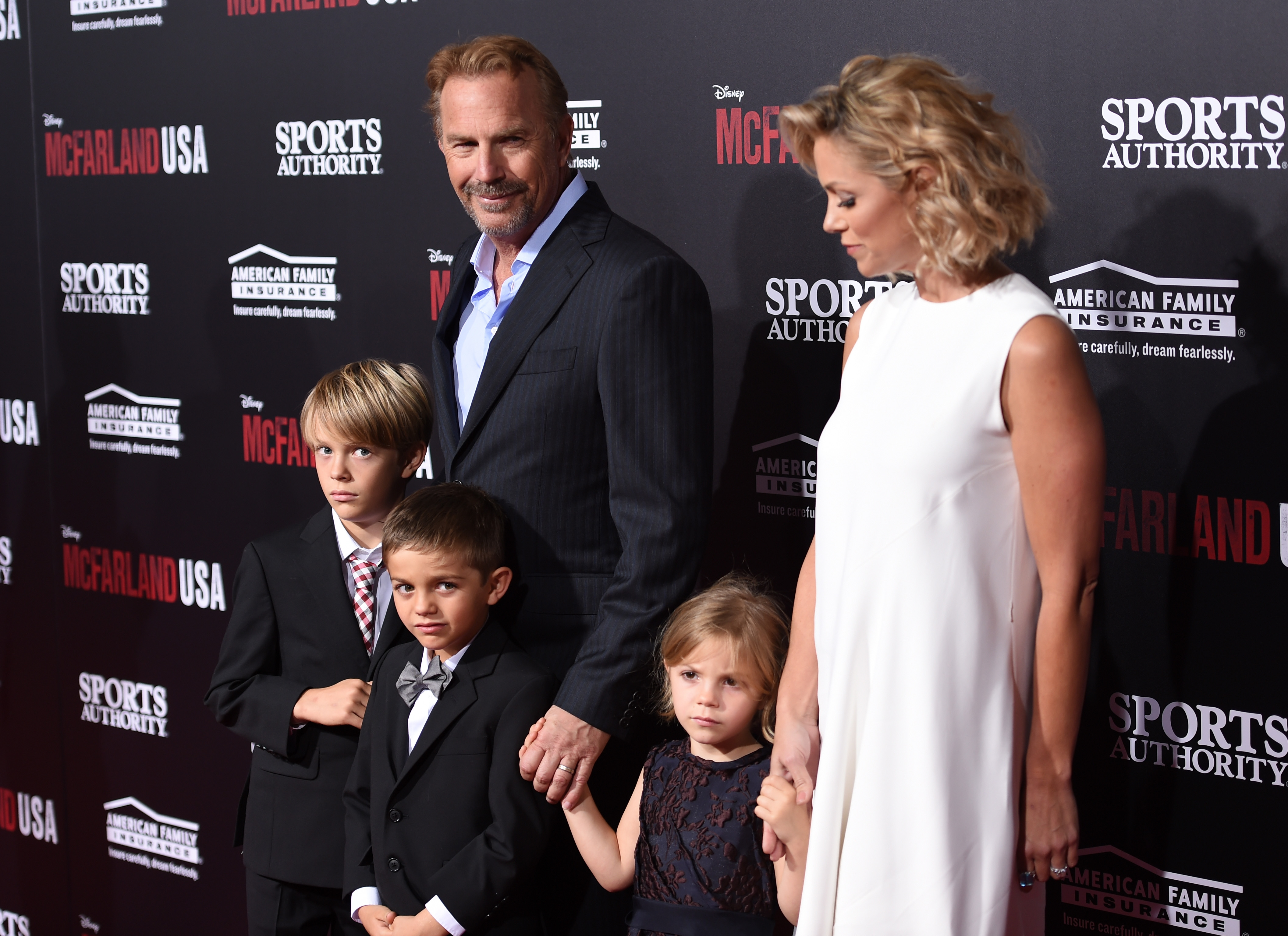 Kevin Costner, his wife Christine Baumgartner, and their children at the world premiere of "McFarland, USA" on February 9, 2015, in Hollywood, California | Source: Getty Images