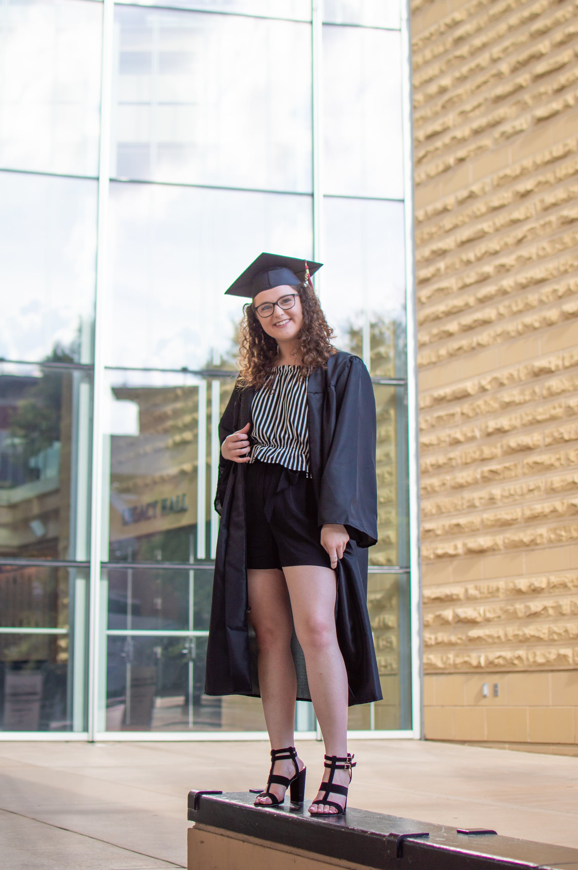 A young woman in graduation gown | Source: Pexels