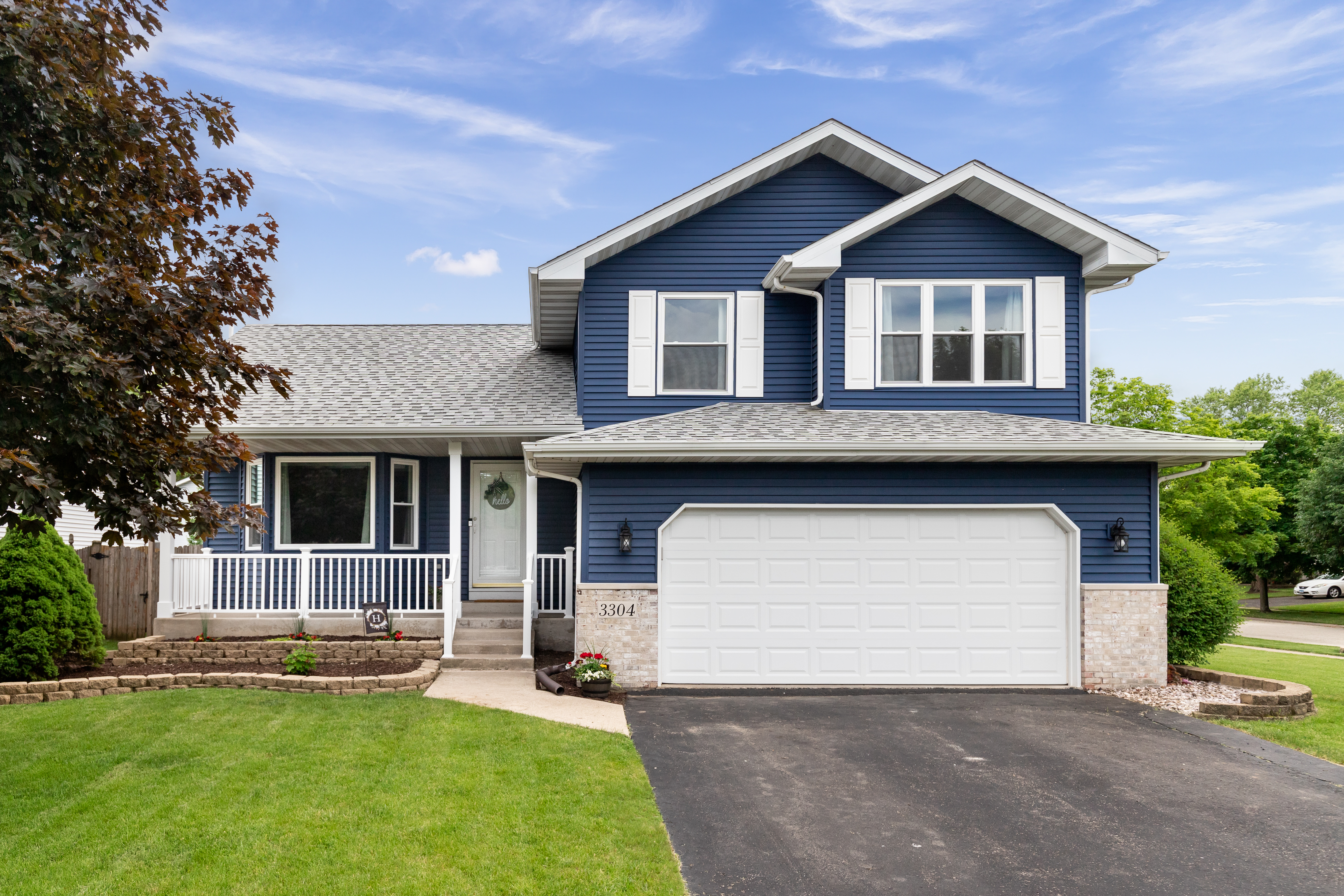 Exterior of a blue suburban home | Source: Getty Images