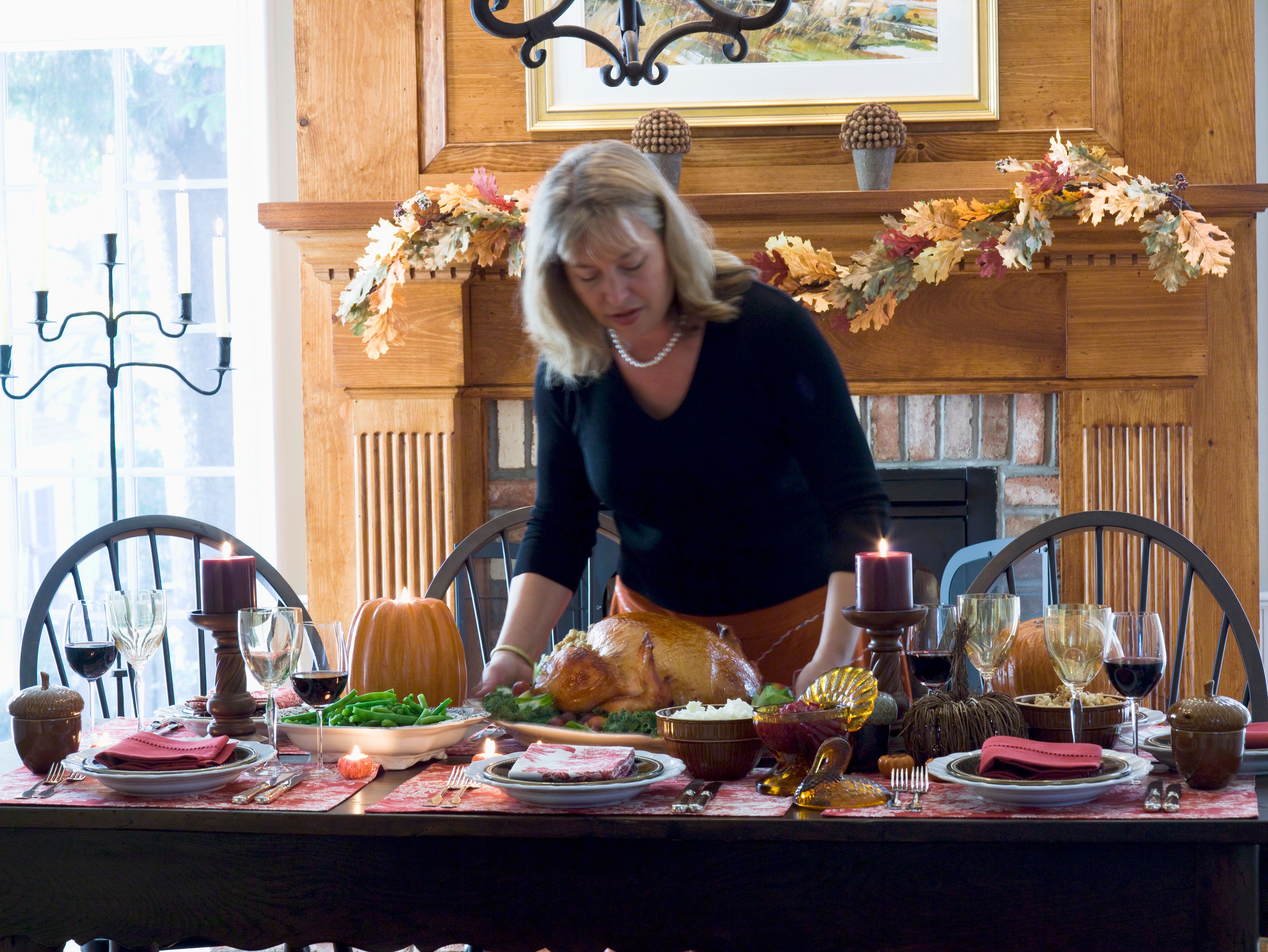 A woman setting the table. | Source: Getty Images