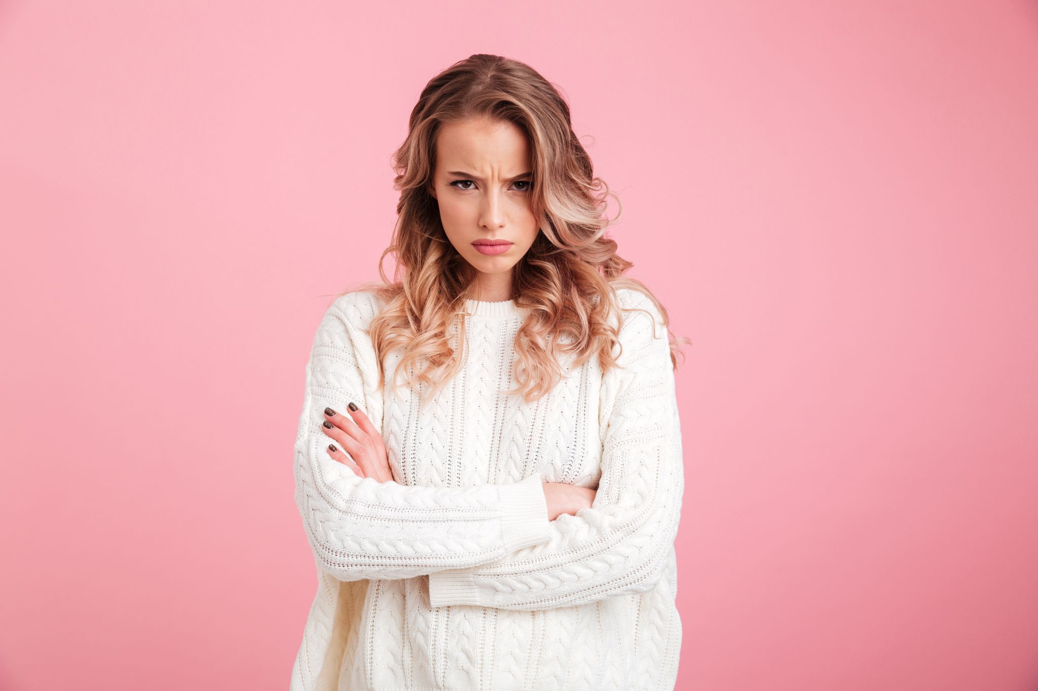 An angry woman with her arms crossed. | Source: Shutterstock