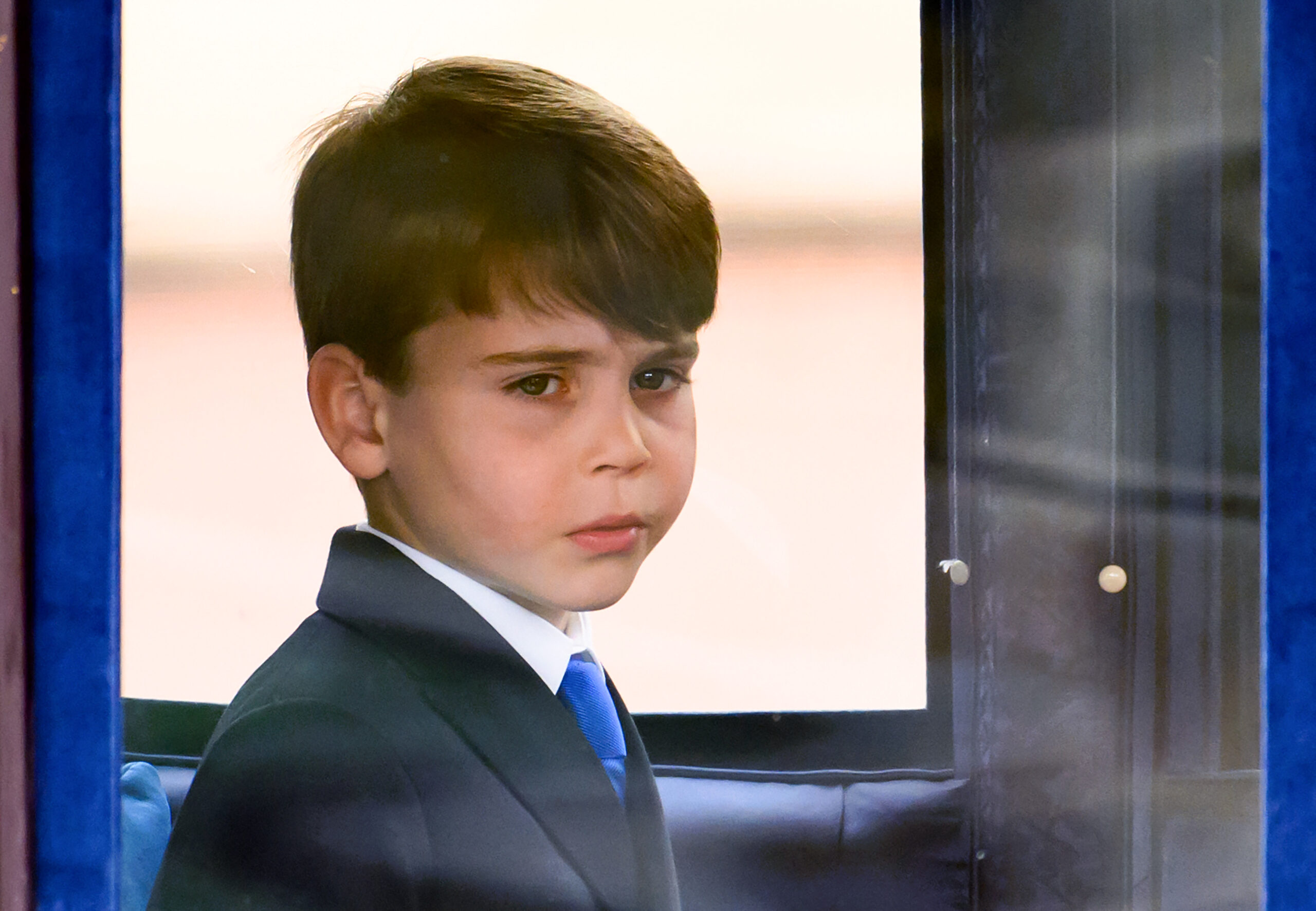 Prince Louis sits in a wagon during Trooping the Colour.